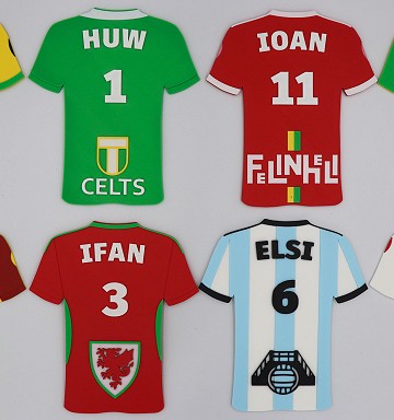 a range of 3d printed football shirts in different styles personalised with names and numbers